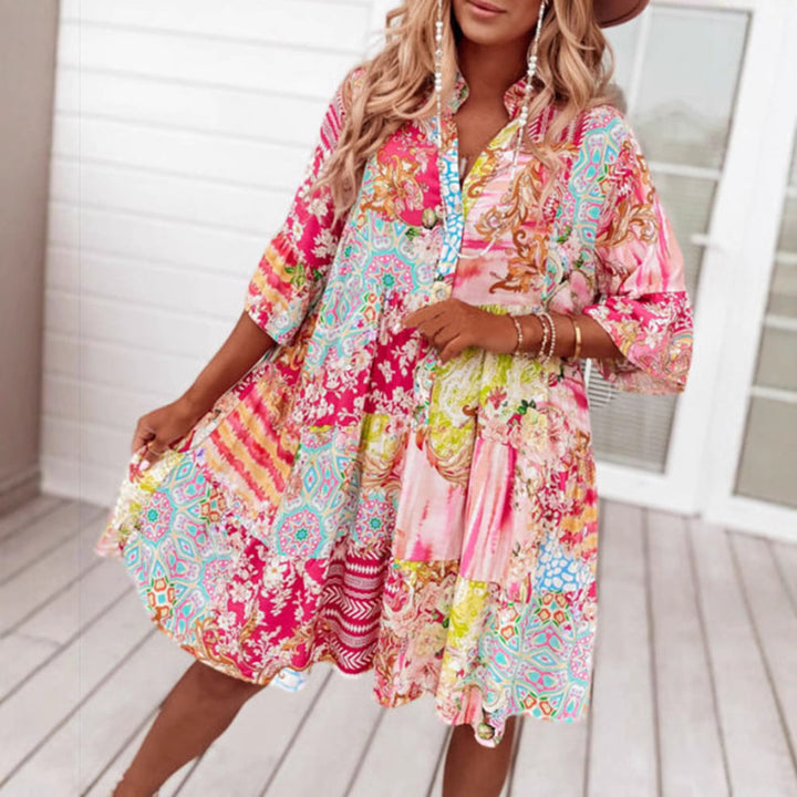 Ladies' airy tiered dress in patchwork boho style with stand collar, gathered waist seam, and three-quarter sleeves StylebySassy