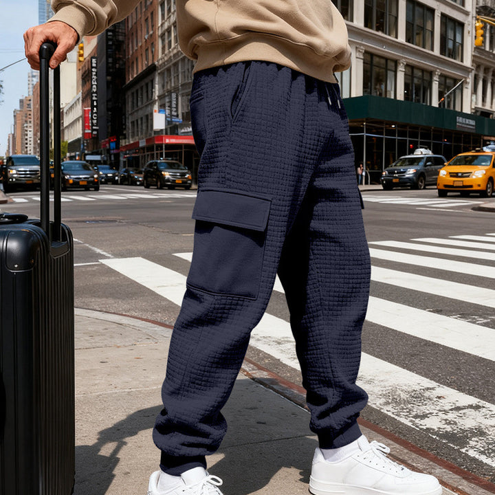Men's waffle texture cargo pants in jogging style with flap pockets and elastic waistband StylebySassy