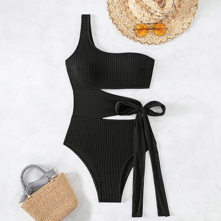 Women's one-piece swimsuit with asymmetrical cut and stylish wrap belt StylebySassy