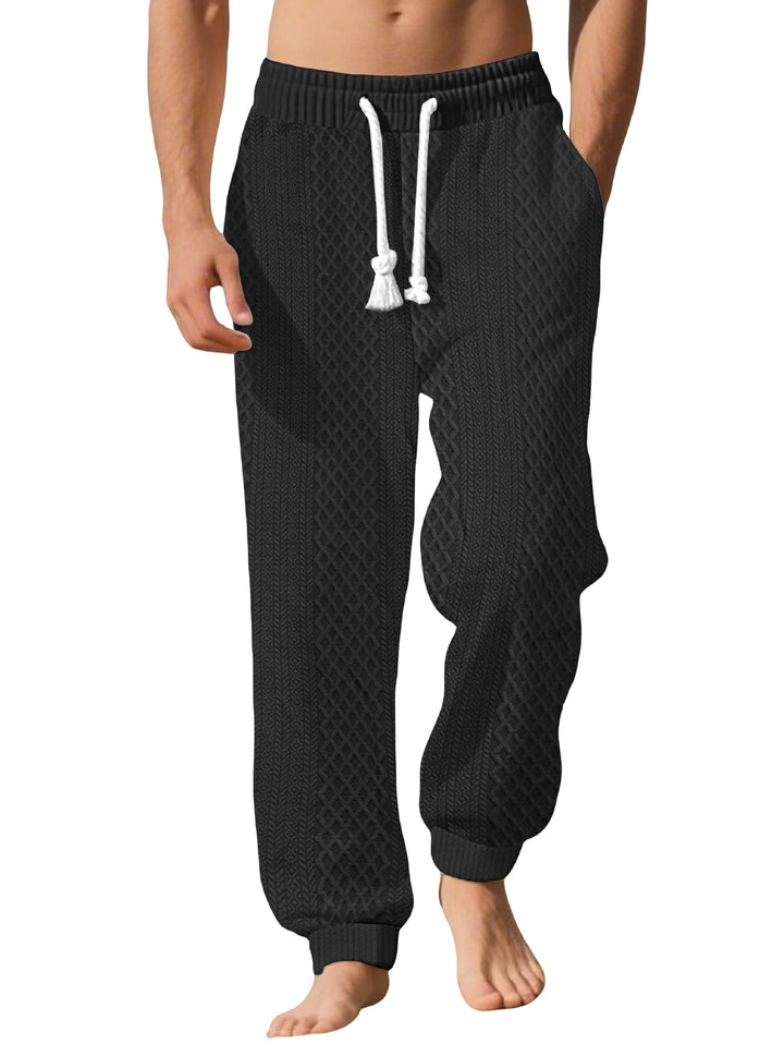 Men's knitted comfort pants with cable structure, elastic waistband, drawstring, and side pockets StylebySassy