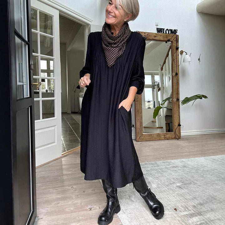 Ladies' loose midi dress with fine pleated look, stand-up collar, short button placket, smocked cuffs, and side pockets StylebySassy