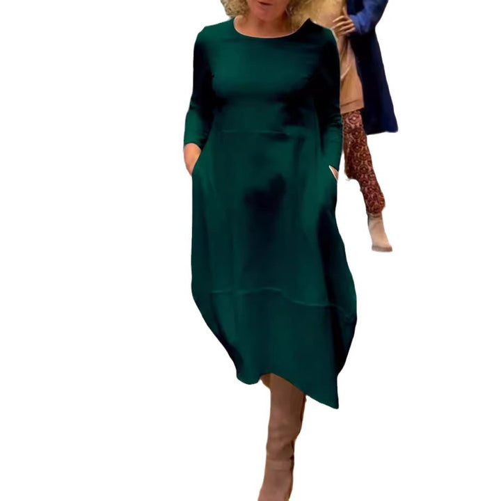 Women's asymmetrical balloon dress with three-quarter sleeves, side pockets, and flowing pointed hem StylebySassy