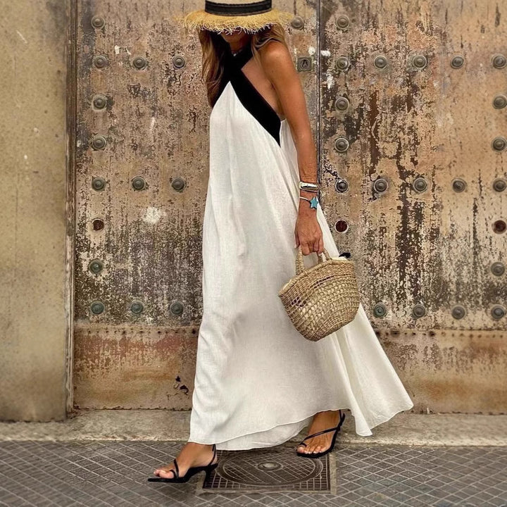 Women’s airy kaftan dress with crossed strap detail, breast yoke and wide fall StylebySassy