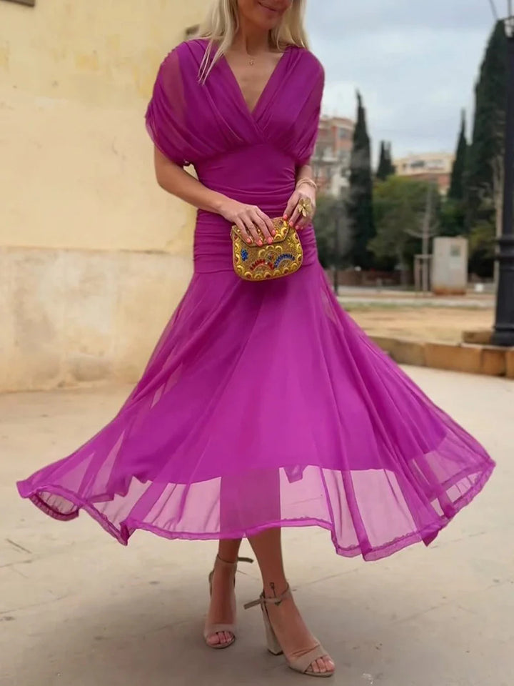Ladies elegant floor-length evening dress with draped shoulder area and airy chiffon skirt StylebySassy