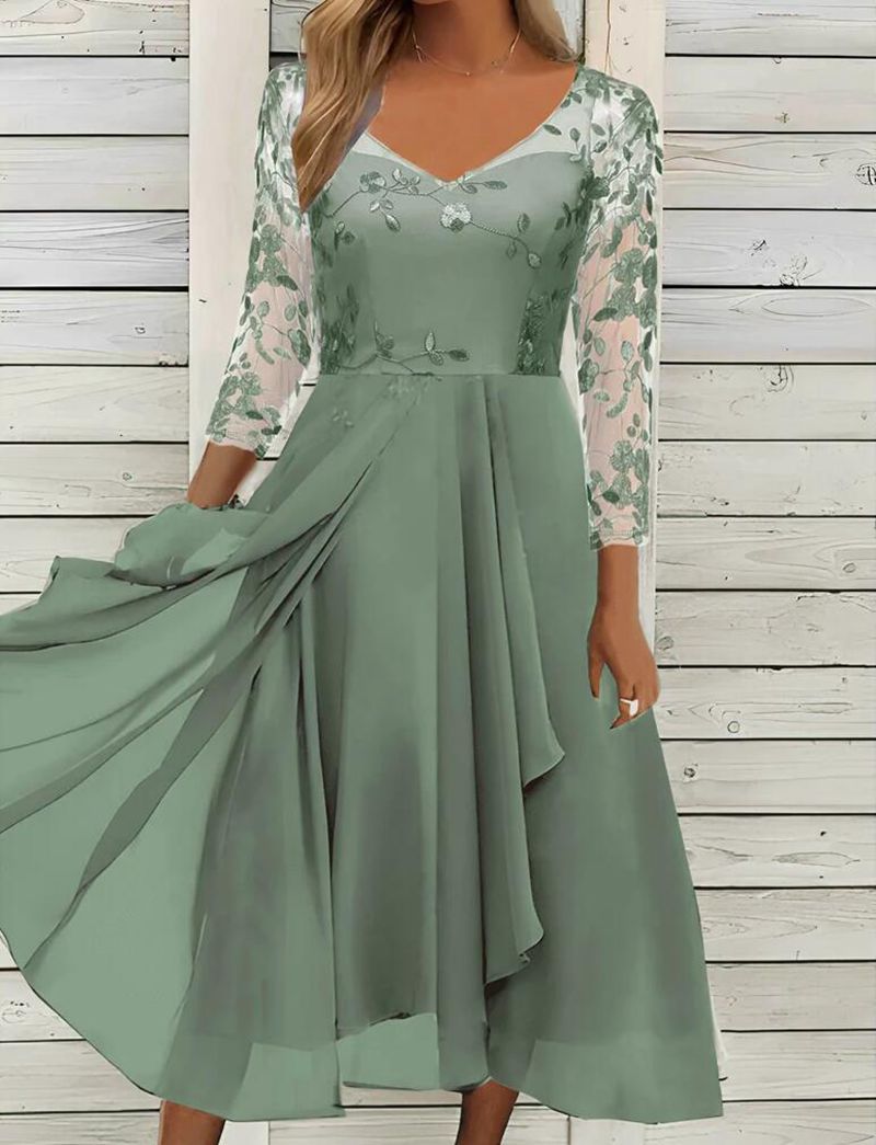 Women’s elegant midi dress with embroidered tulle top, transparent three-quarter sleeves, and layered draped skirt StylebySassy