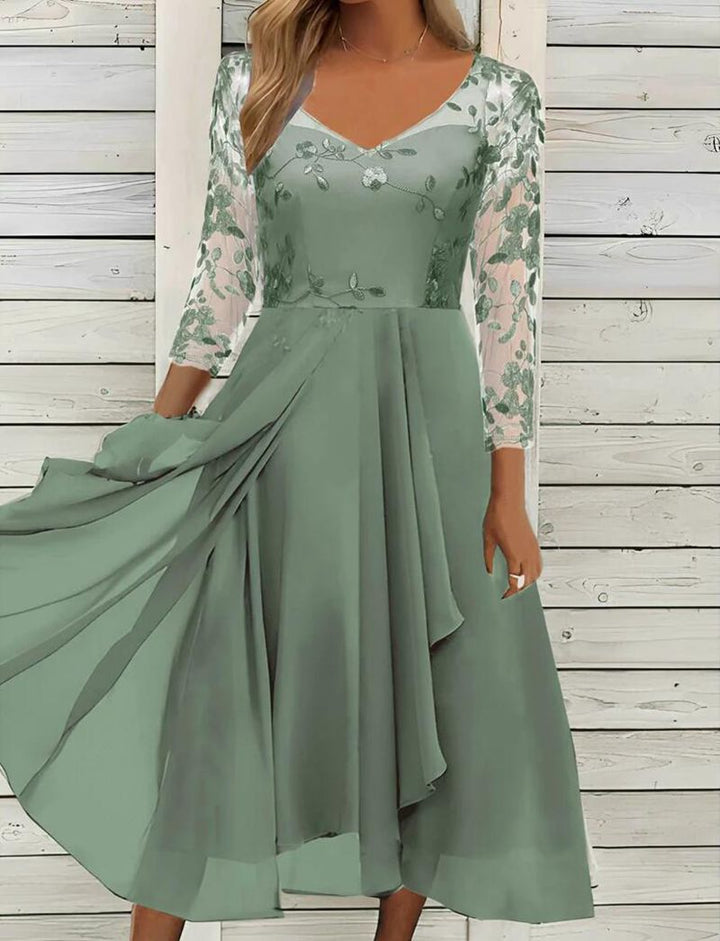 Women's V-neck chiffon midi dress with embroidered bodice, transparent three-quarter sleeves, and asymmetric layered skirt StylebySassy