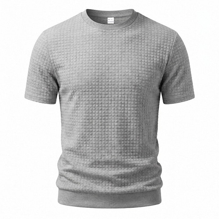 Men's short-sleeved knit shirt with embossed check structure, round neckline, and ribbed hem StylebySassy