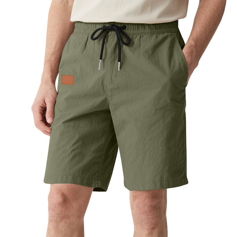 Men's quick-drying swim shorts in Bermuda cut with elastic waistband and drawstring StylebySassy