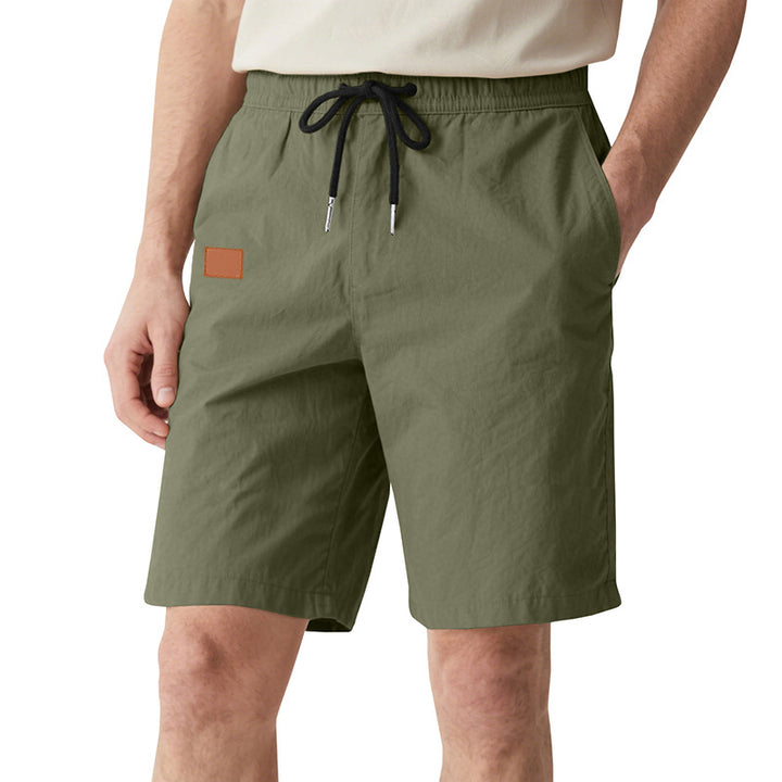 Men's quick-drying swim shorts in Bermuda cut with elastic waistband and drawstring StylebySassy