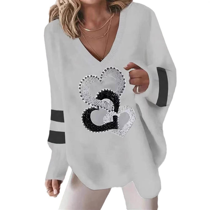 Women's oversized knitted sweater with deep neckline sequin heart and contrast sleeve stripes StylebySassy