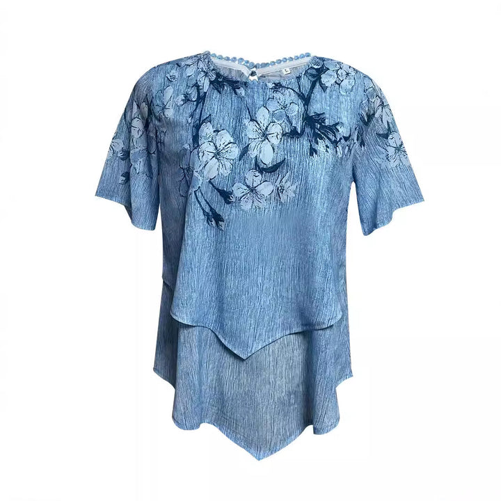 Women's two-layer blouse dress with asymmetrical tiered hem, floral print yoke, and wing sleeves StylebySassy