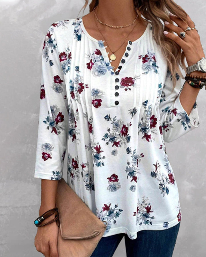 Women's floral tunic blouse with pleats and decorative button placket StylebySassy