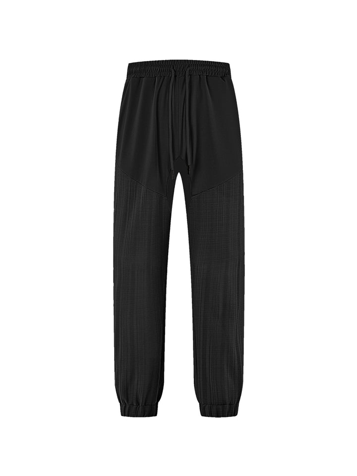 Men's slim-fit jogging pants with elastic drawstring waistband and textured knee panel StylebySassy