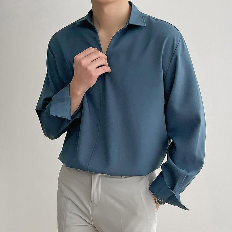 Women's loosely cut tunic blouse with deep V-neck, concealed button placket, and dropped shoulders StylebySassy