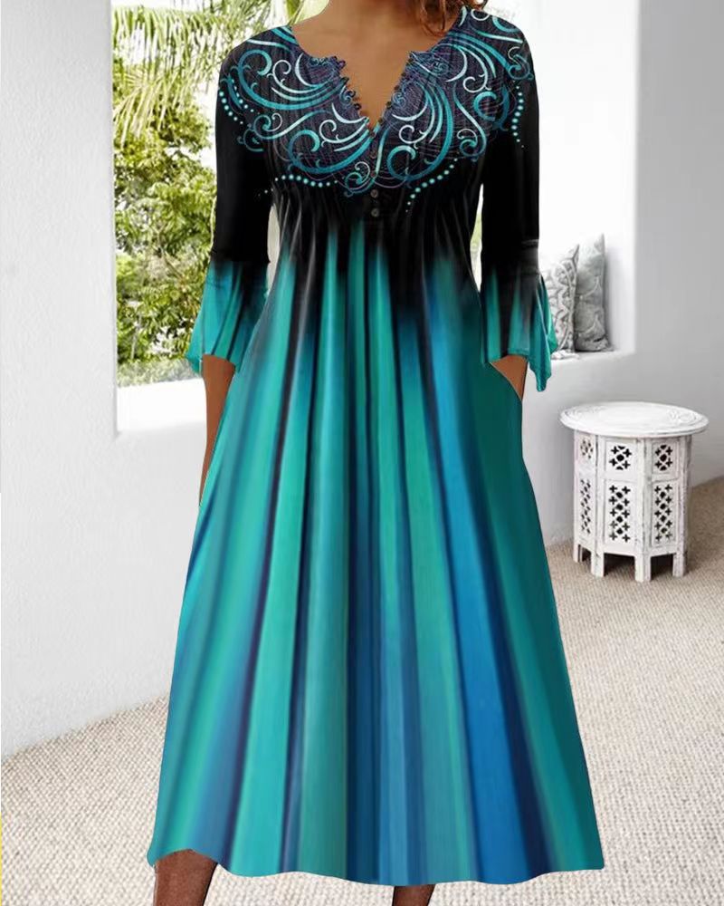 Women's flowing maxi dress with embellished V-neck, underbust seam, flared skirt and side pockets StylebySassy