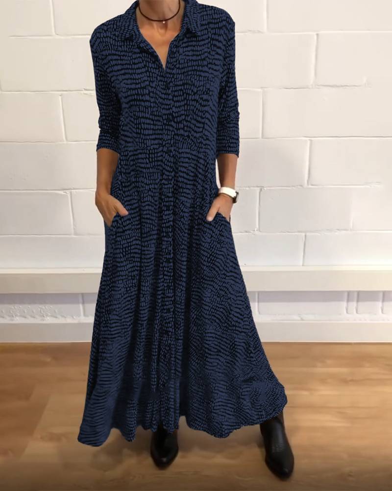 Women's flowing maxi dress with shirt collar, V-neck, three-quarter sleeves, and side pockets StylebySassy