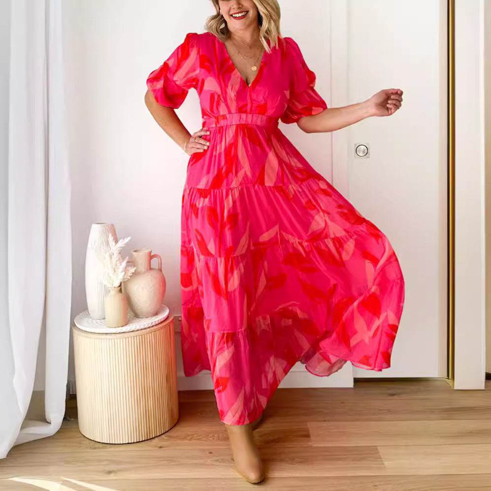 Ladies' flared maxi dress with V-neck, elastic underbust seam, and tiered skirt StylebySassy