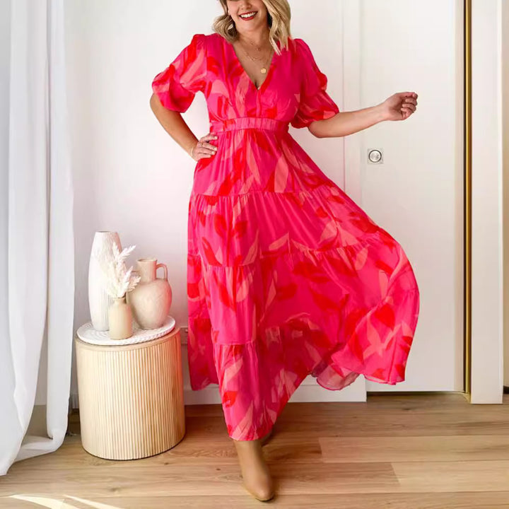 Ladies' flared maxi dress with V-neck, elastic underbust seam, and tiered skirt StylebySassy