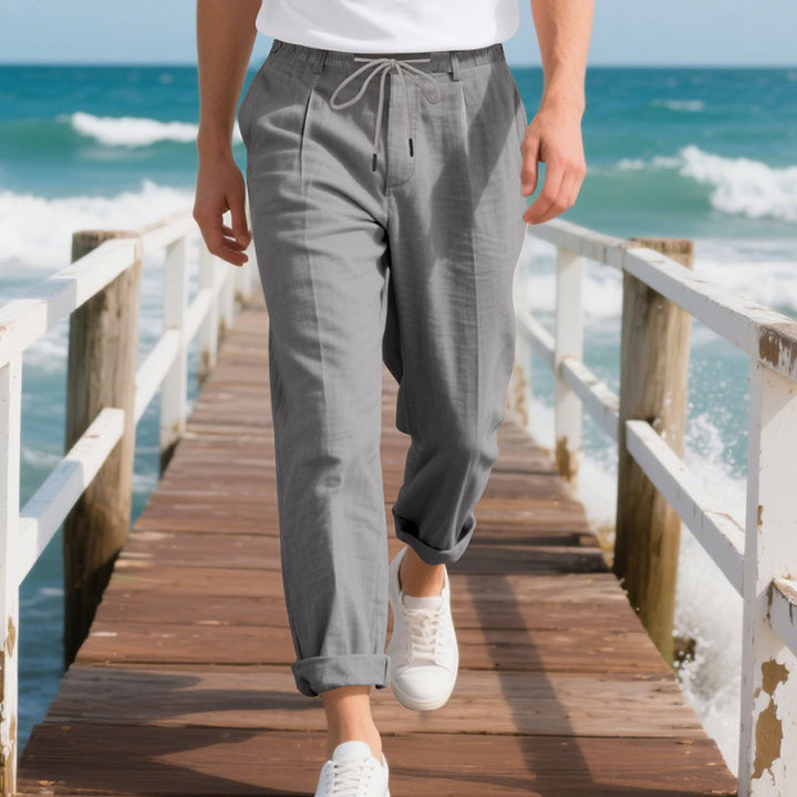 Men's beach-suitable linen blend lounge pants with elastic drawstring, subtle pleat, and rolled ankle hem StylebySassy