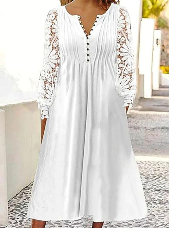 Ladies' knee-length A-line summer dress with crocheted long sleeves, pleated bodice and decorative button placket StylebySassy