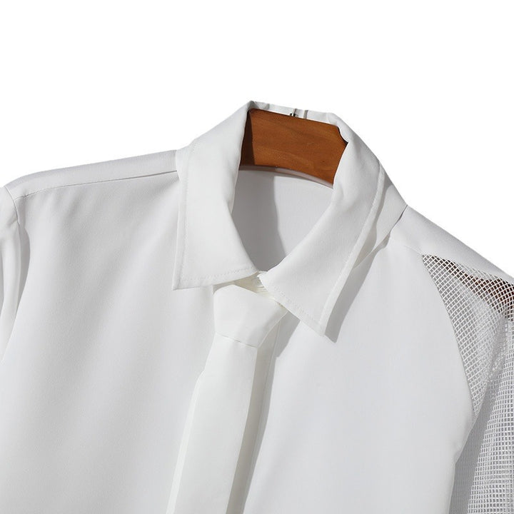 Women’s flowing blouse with attached bow, concealed button placket, and one-sided mesh sleeve detail StylebySassy