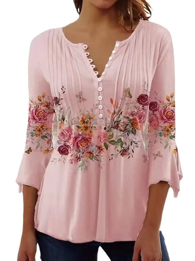 Ladies airy tunic blouse with watercolor floral border, knife pleats, and three-quarter sleeves StylebySassy
