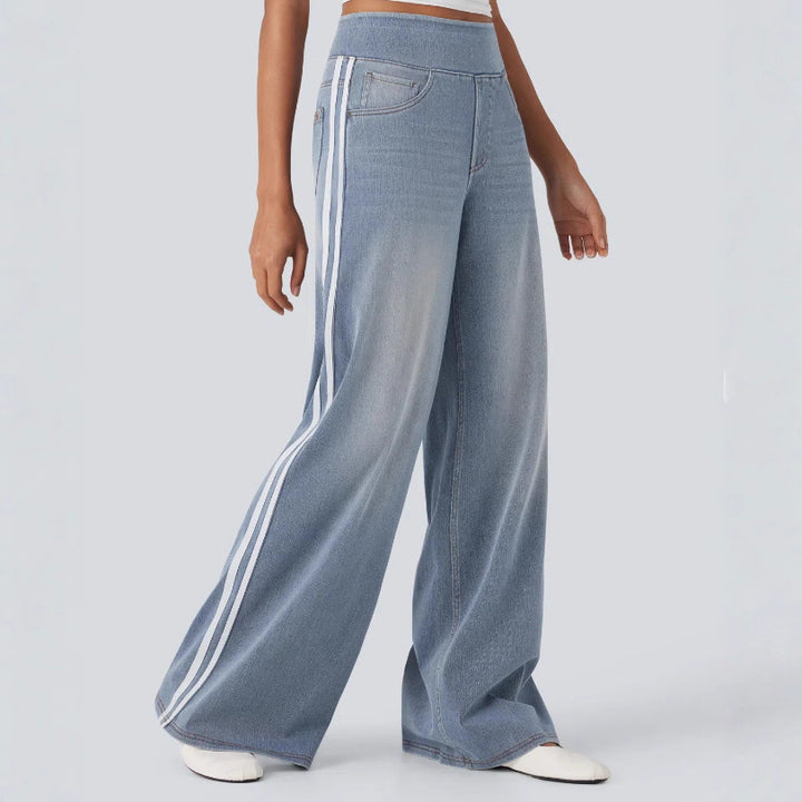 Women's casual wide jogging pants in denim look with elastic comfort waistband, contrasting side stripes and pockets StylebySassy