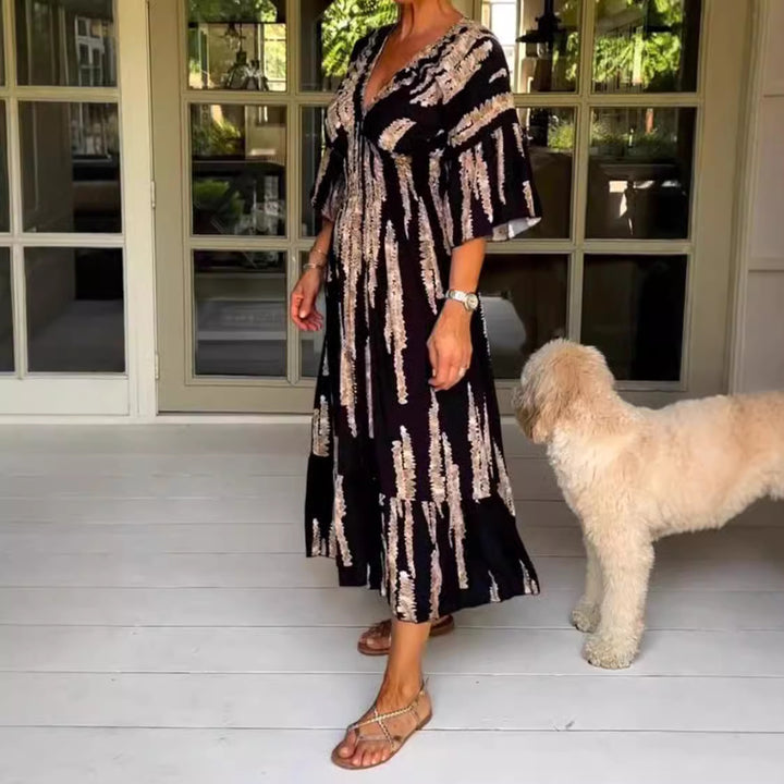 Ladies' V-neck maxi dress with brushstroke pattern, gathered underbust, balloon sleeves, and ruffled tiers StylebySassy