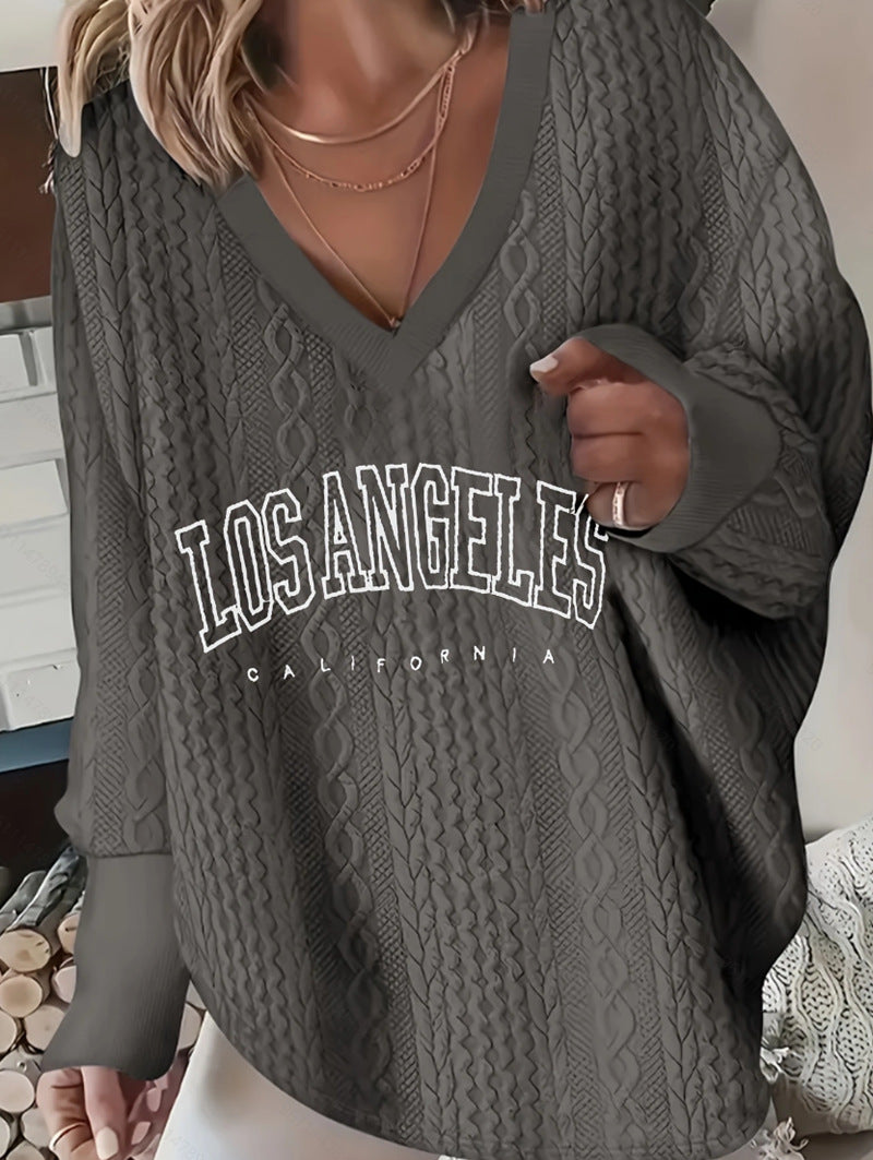 Women's oversized cable knit sweater with V-neck and logo print StylebySassy