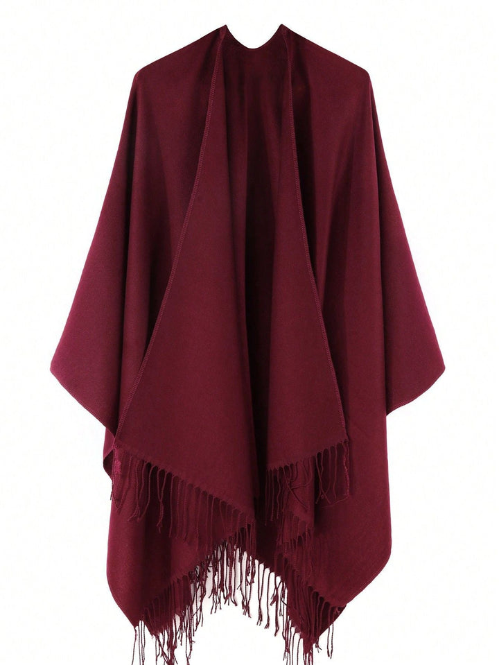 Women's fashionable fringe poncho made of soft material with luxurious drape StylebySassy