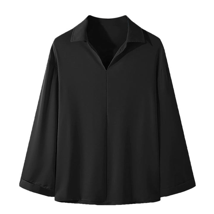 Women's loosely cut tunic blouse with deep V-neck, concealed button placket, and dropped shoulders StylebySassy