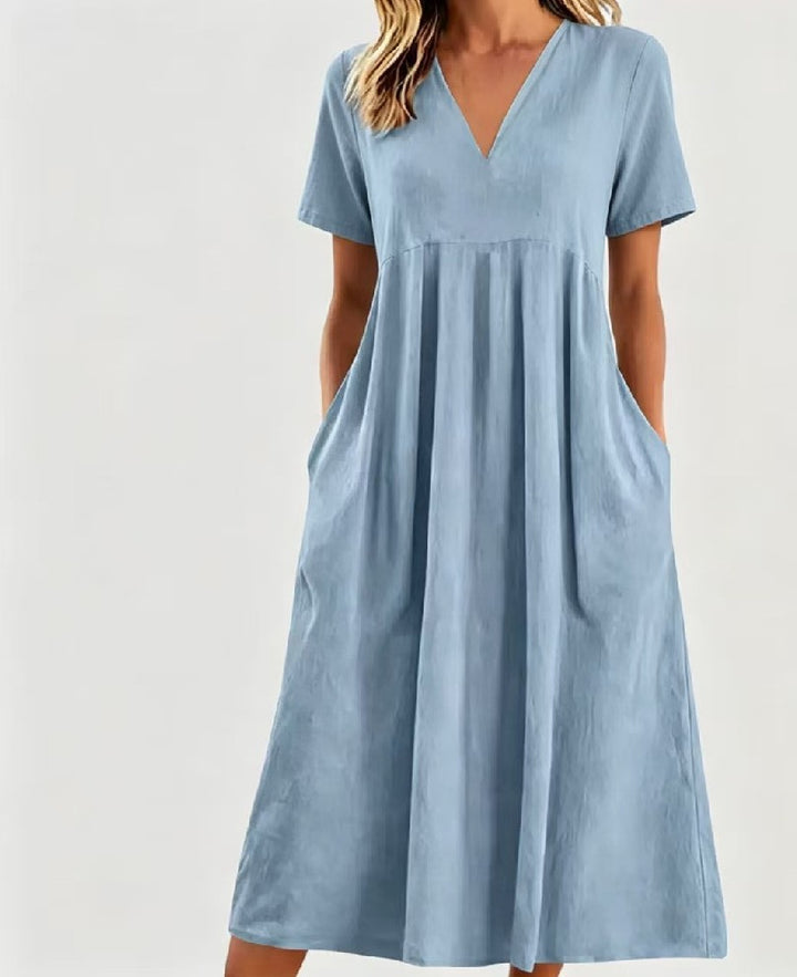 Women nan legeres V-neck midi dress with side pockets and gathered empire seam StylebySassy