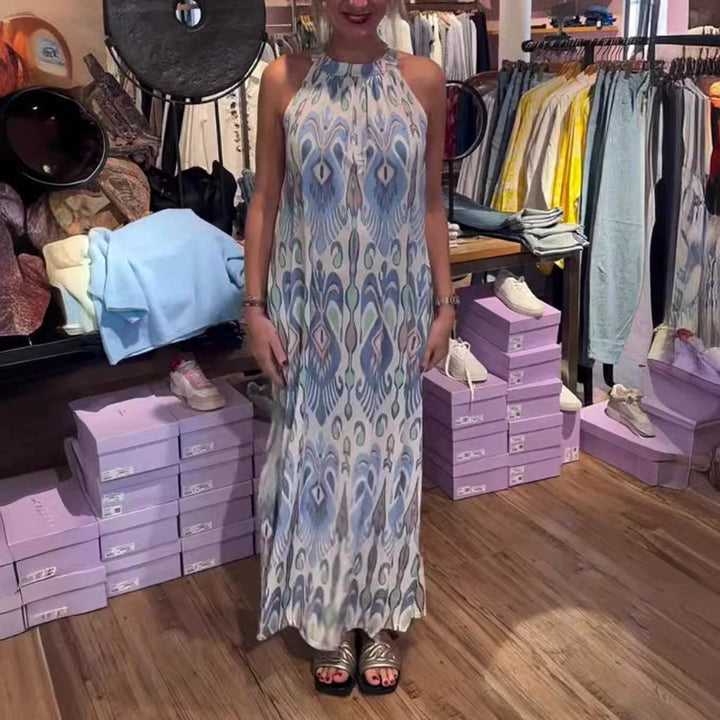 Women's flowing maxi dress with halter neck, ornamental ikat print and wide fall StylebySassy