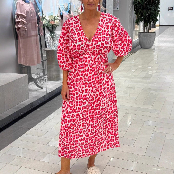 Women's maxi dress with deep V-neck, voluminous puff sleeves, and smocked waist seam StylebySassy
