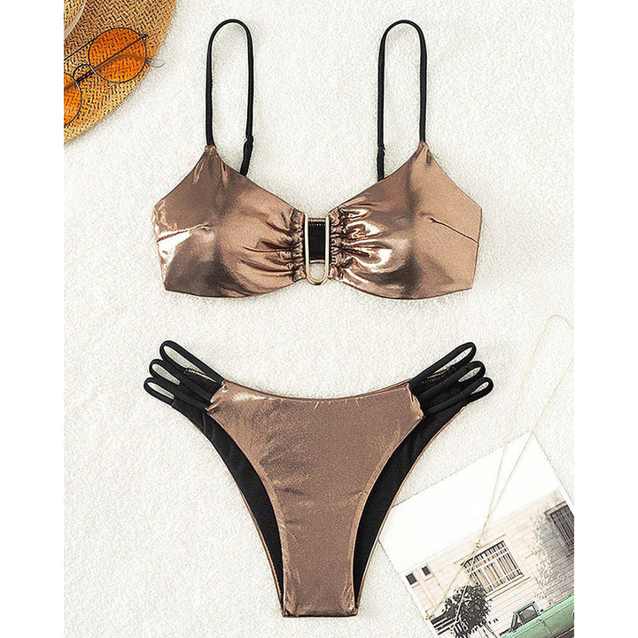 Women's bikini set with intricate lace-up look and golden accents StylebySassy