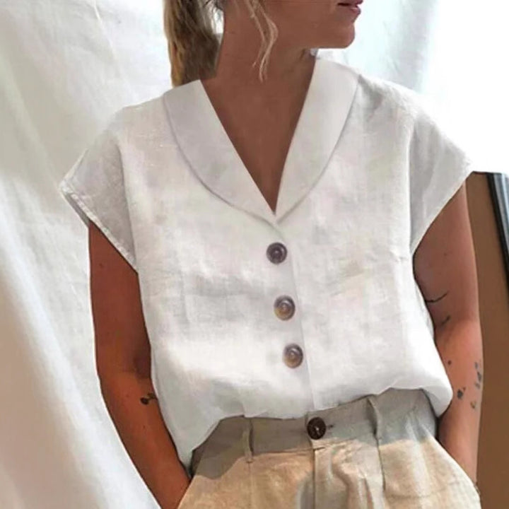 Women's airy linen blouse with wide V-neck, dropped shoulder and decorative button placket StylebySassy