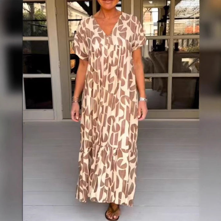 Women's voluminous maxi dress with under-bust seam, V-neck, short kimono sleeves, and tiered ruffle StylebySassy