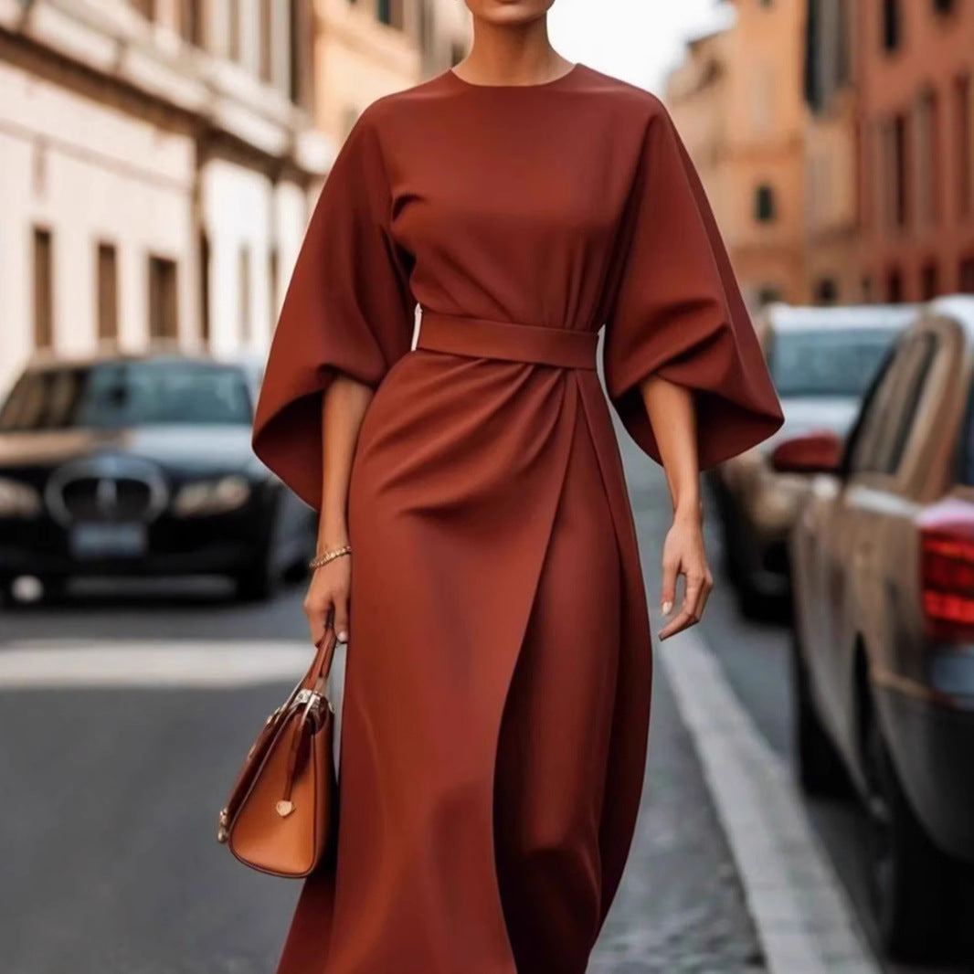Women's minimalist evening dress with overlong wide sleeves and waist-sculpting pleat draping StylebySassy