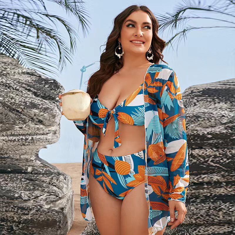 Women's bikini set with floral wrap top and elegant beach jacket StylebySassy