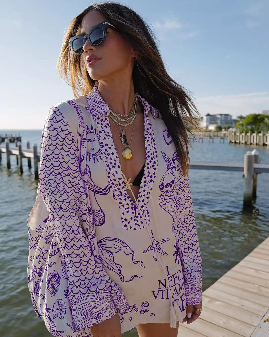 Ladies lightweight beach cover-up in tunic form with deep V-neck, tassel closure, and nautical ocean print StylebySassy