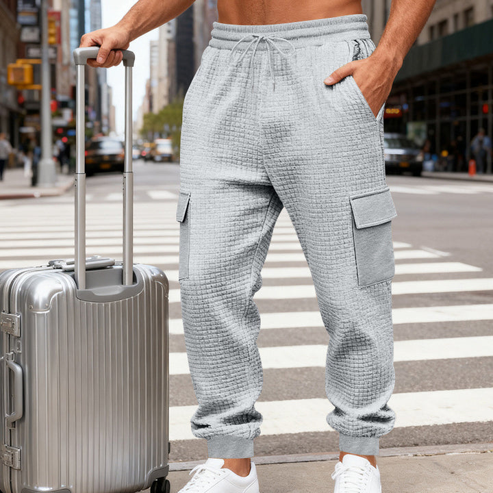 Men's waffle texture cargo pants in jogging style with flap pockets and elastic waistband StylebySassy