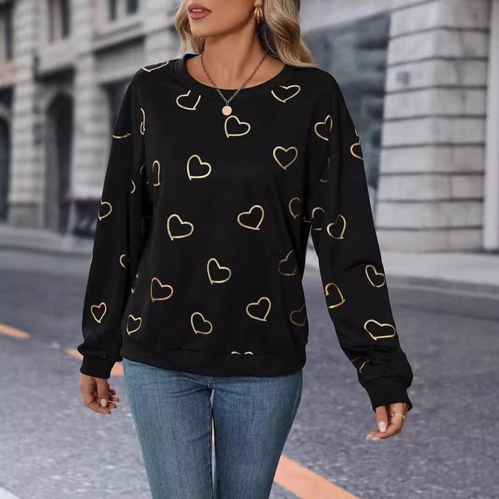 Women's loose heart print sweatshirt with round neck and ribbed cuffs StylebySassy