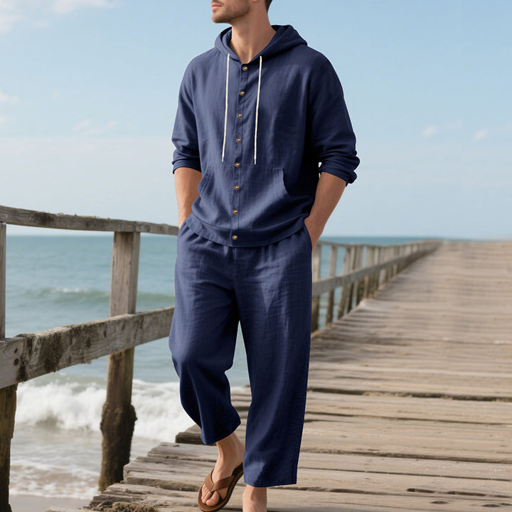 Men's casual linen-cotton ensemble with hooded top and full button placket, kangaroo pocket, and ankle-length wide trousers StylebySassy