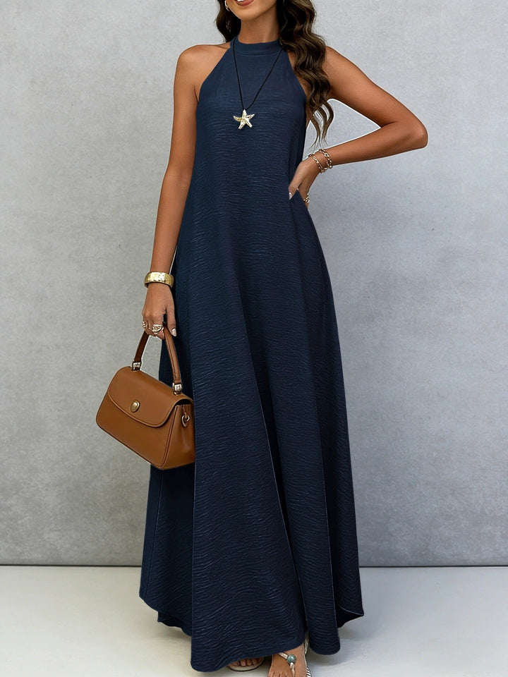 Women’s sleeveless maxi dress with high standing collar, flowing A-line and crepe texture StylebySassy