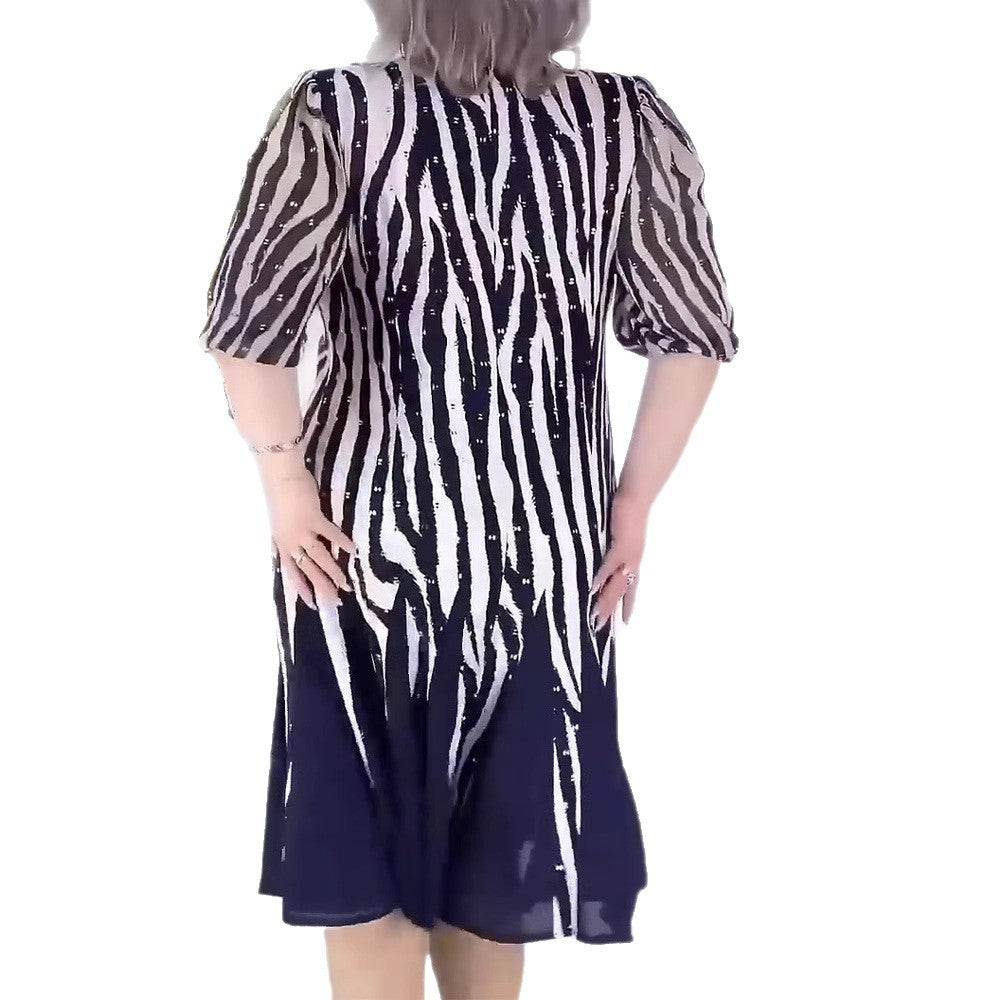 Ladies' fitted midi dress with graphic animal print, transparent puff sleeves and swinging pleated skirt StylebySassy