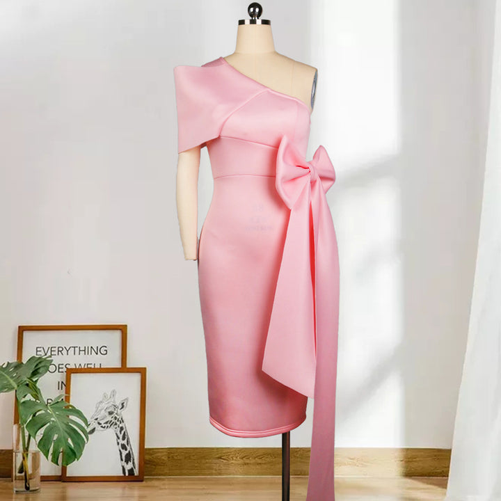 Women figure-hugging evening dress with asymmetric neckline and voluminous bow accent StylebySassy