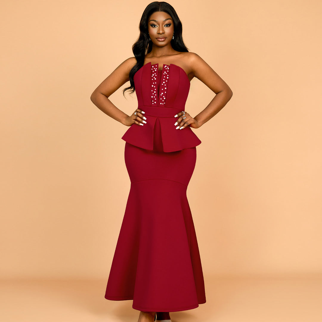 Women's evening dress with shimmering details and voluminous peplum drape