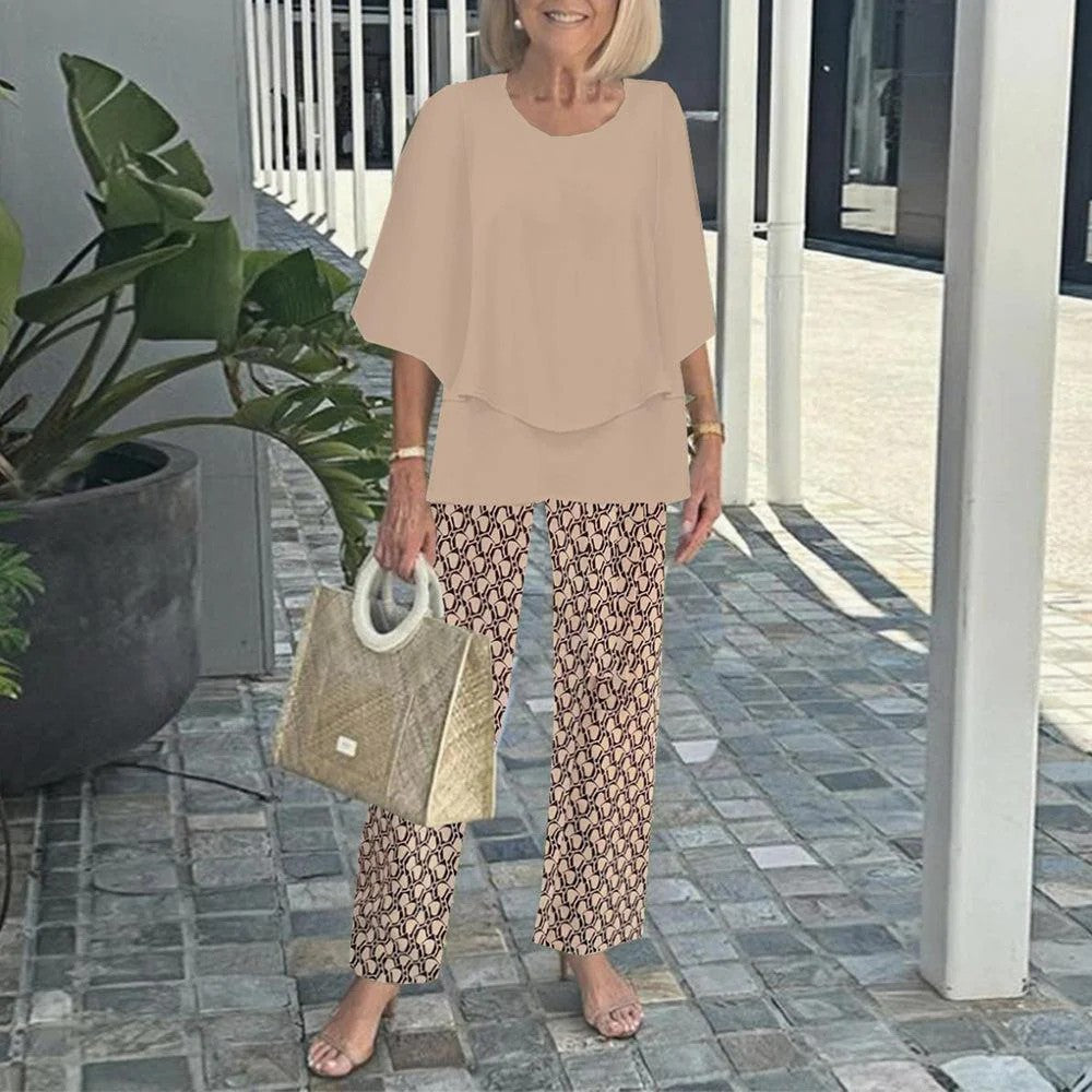 Women's layered tunic with cape sleeves and ankle-length straight leg pants with graphic print StylebySassy