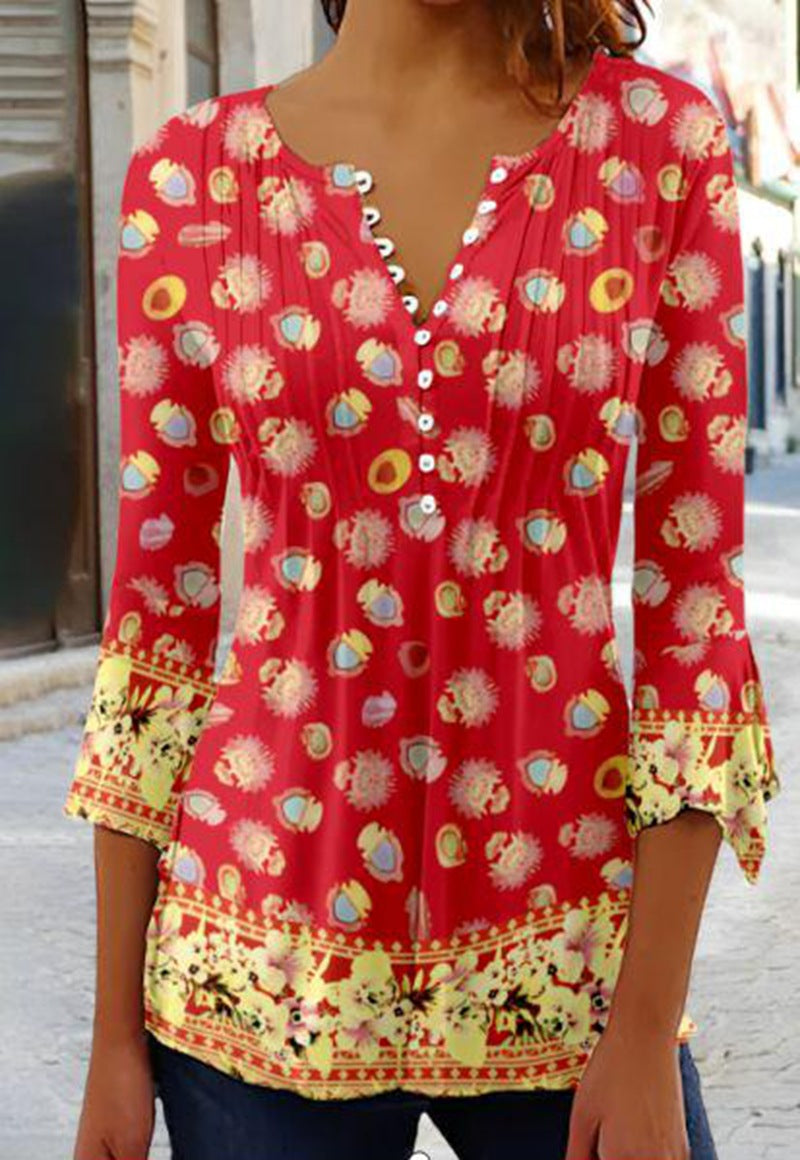 Women's flowing V-neck tunic with decorative button placket, chest pleats, three-quarter sleeves, and floral border edge StylebySassy