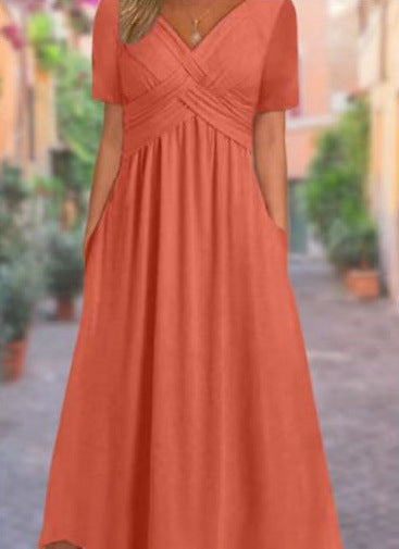 Women's airy midi dress with V-neck, wrap look, empire waist, and pockets StylebySassy